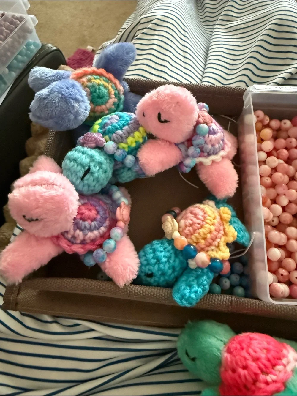 Pink plush toy turtle with crocheted with small turtle gemstone bracelet!